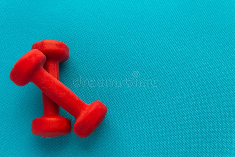 Red Dumbbells on a Blue Fitness Mat Stock Image - Image of group ...