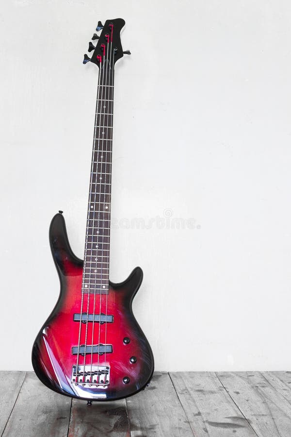 Red electric bass guitar stock photo. Image of brown 41275648