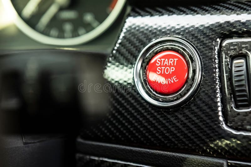 Red Engine Start Button Detail. Car Dashboard with Focus on Red Engine