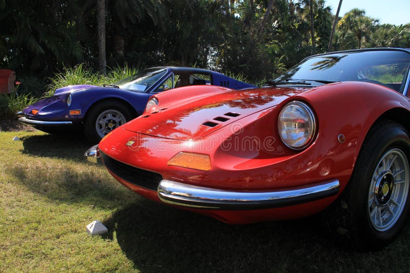 Classic red ferrari dino 246 gt sports car in line up next to violet dino 246 gt sports car at cavallino 2012. 02. Classic red ferrari dino 246 gt sports car in line up next to violet dino 246 gt sports car at cavallino 2012. 02