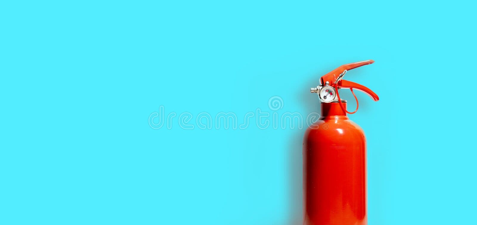 Red Fire Extinguisher and its shadow isolated on blue-green color background - Copy space - Business Concept stock photography Red Fire Extinguisher and its shadow isolated on blue-green color background - Copy space - Business Concept stock photography