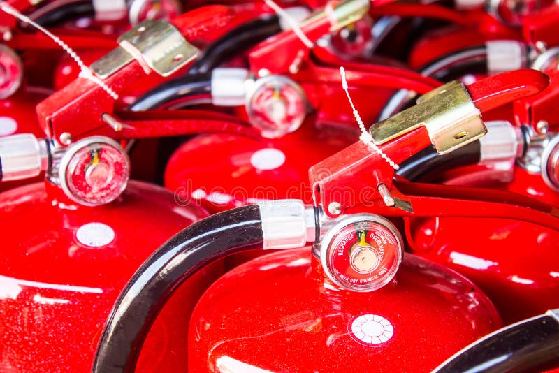 Red fire extinguishers stock images