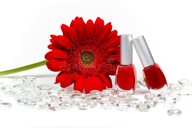 Red flower and nail polishes