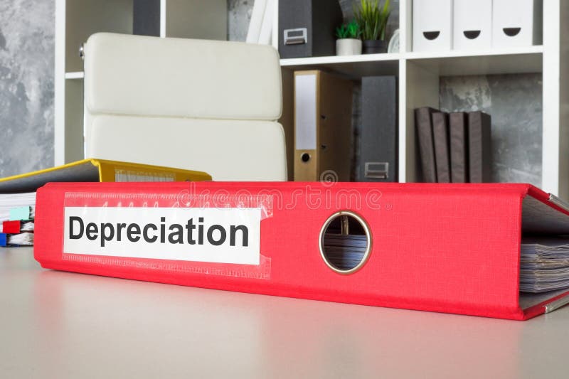 Red folder labeled depreciation in an office. Asset value reduction. royalty free stock photo