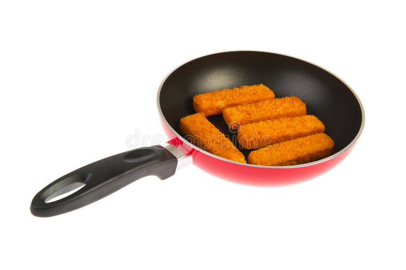 Red frying pan with fish sticks stock photos