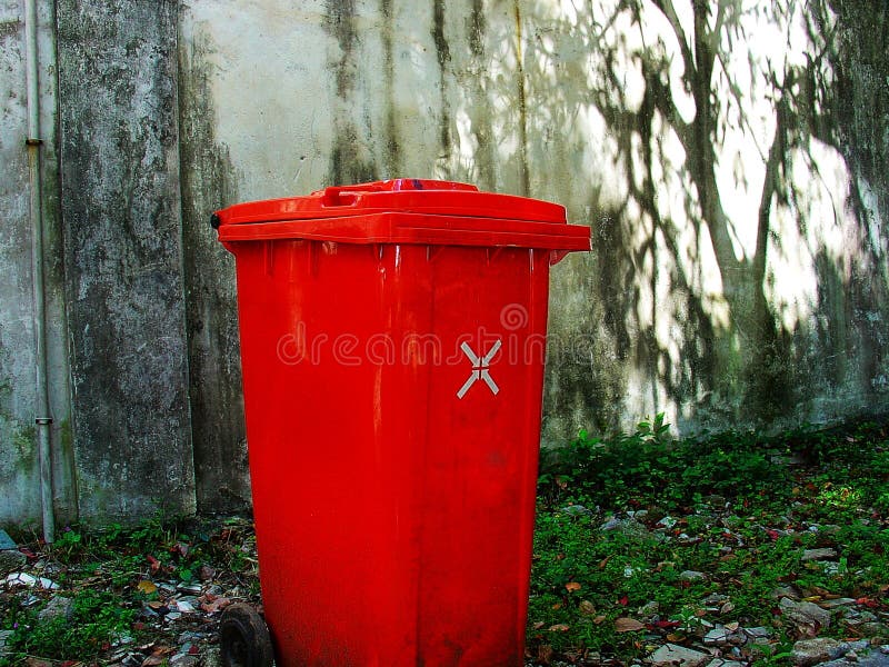 Red Garbage Can Against Wall Stock Image Image of recycle, wall