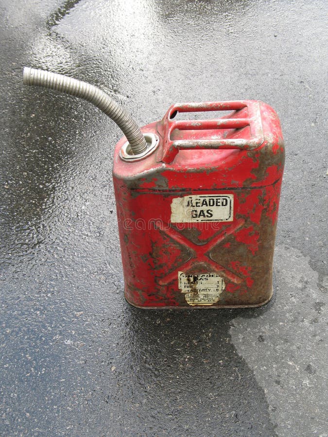 Red gas can on the pavement