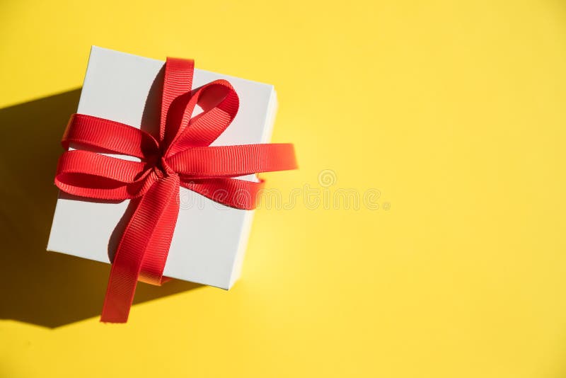 Download 887 White Square Gift Box Yellow Ribbon Bow Photos Free Royalty Free Stock Photos From Dreamstime Yellowimages Mockups