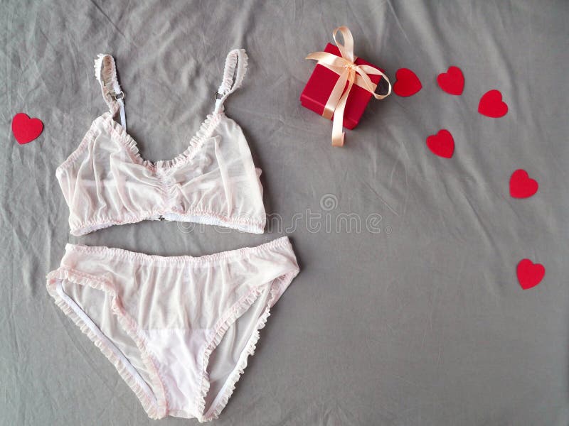 Lace Womens Underwear, Red Heart on White Bed Background. Flat Lay