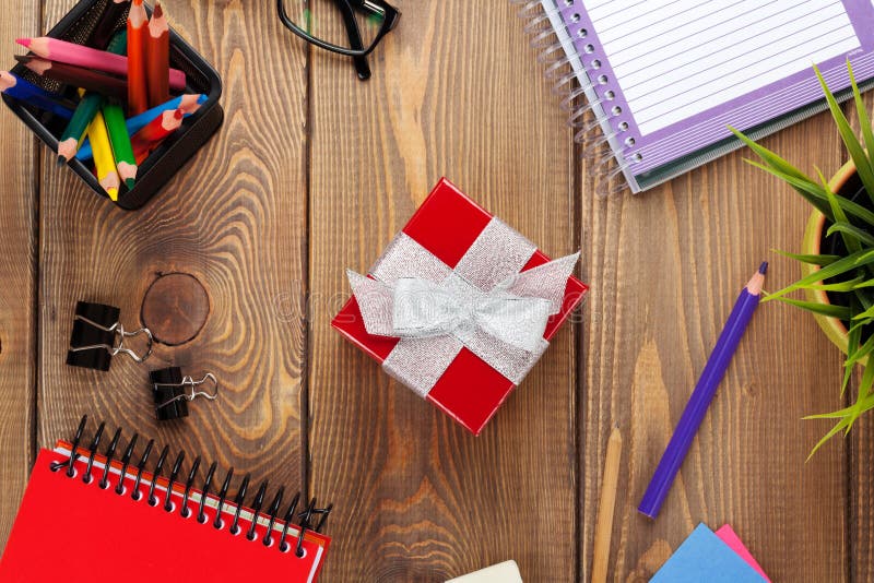 Red Gift Box and Office Supplies Over Office Table Stock Photo Image