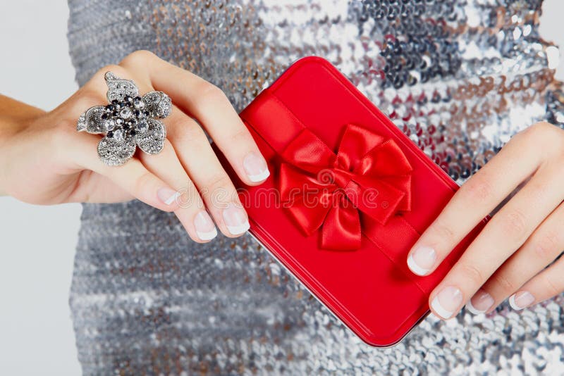 Red gift box in woman's hands. stock photography Red gift box in woman's hands. stock photography