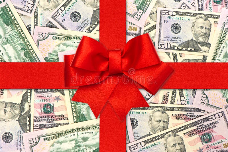 Red gift ribbon bow over american dollars