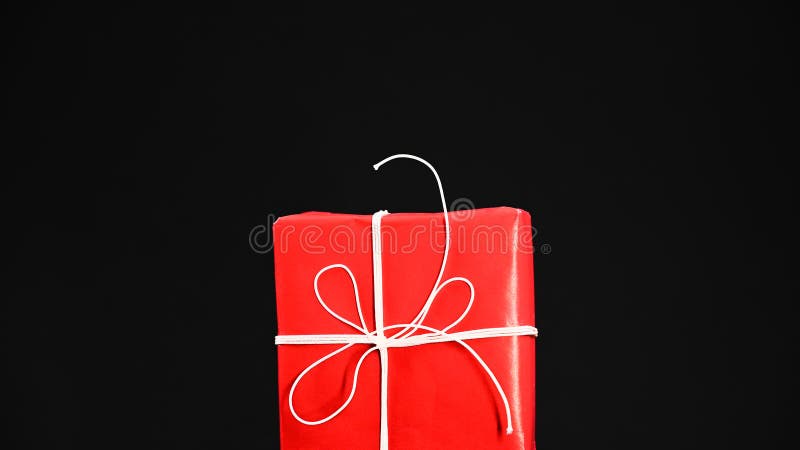 Red Gift Wrap on Black Background Stock Image - Image of decor, year
