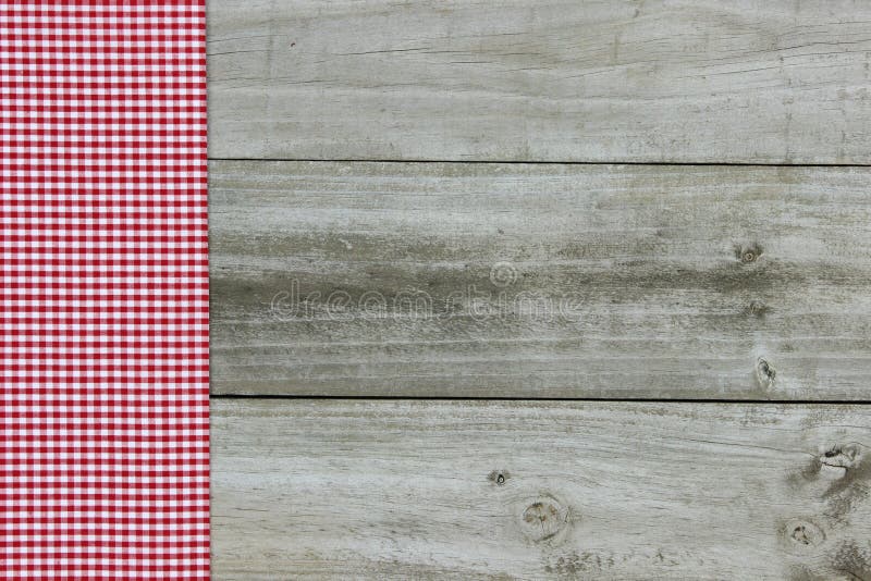 Red gingham border on wood background