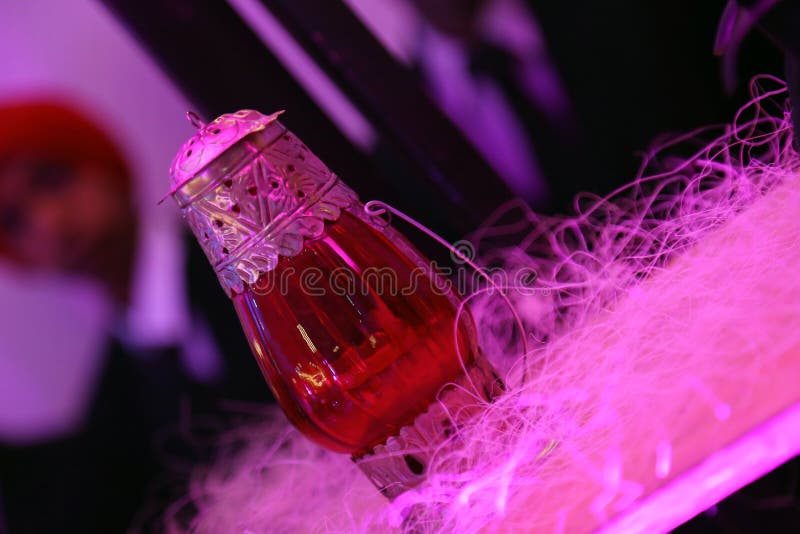 Red glass lamp with metal work isolated with blur background stock photo Red glass lamp with metal work isolated with blur background stock photo