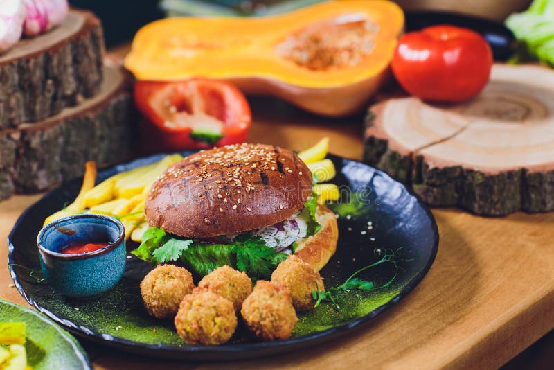 Red, Green,black Mini Burgers with Quinoa and Vegetables. Stock Photo