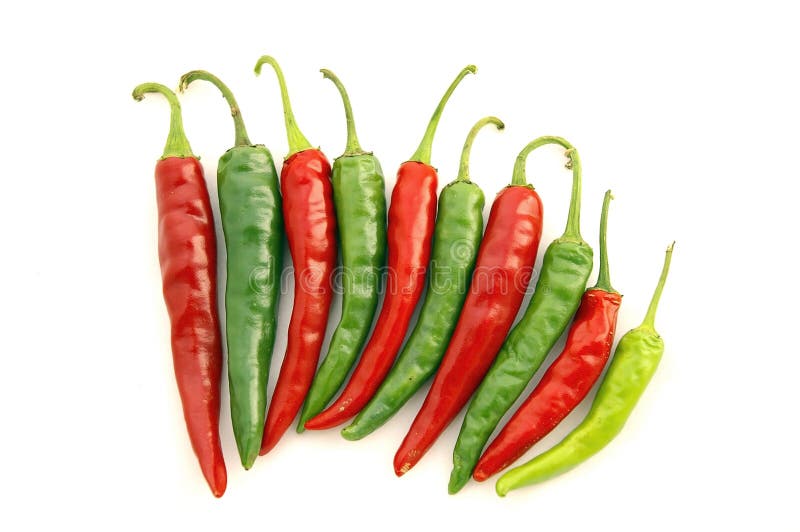 Isolated closeup of ten (10) fanned-out Red and Green Hot Chili Peppers against a white background with stems up. Isolated closeup of ten (10) fanned-out Red and Green Hot Chili Peppers against a white background with stems up.