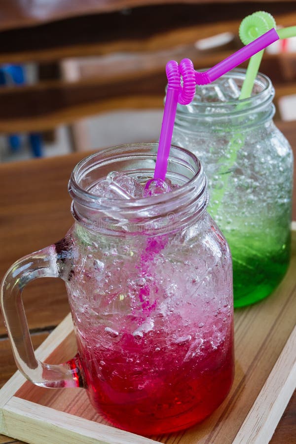 Red and Green Water Mix Soda on Table Blackground,process Color. Stock