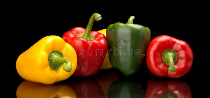 Red,green,yellow bell peppers isolated on black royalty free stock photography Red,green,yellow bell peppers isolated on black royalty free stock photography
