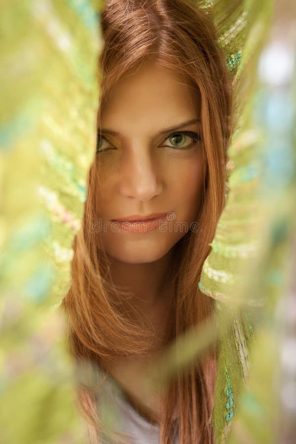 Red hair beautiful woman in green kerchief