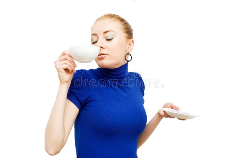 Red-haired beautiful woman enjoying cup of coffee