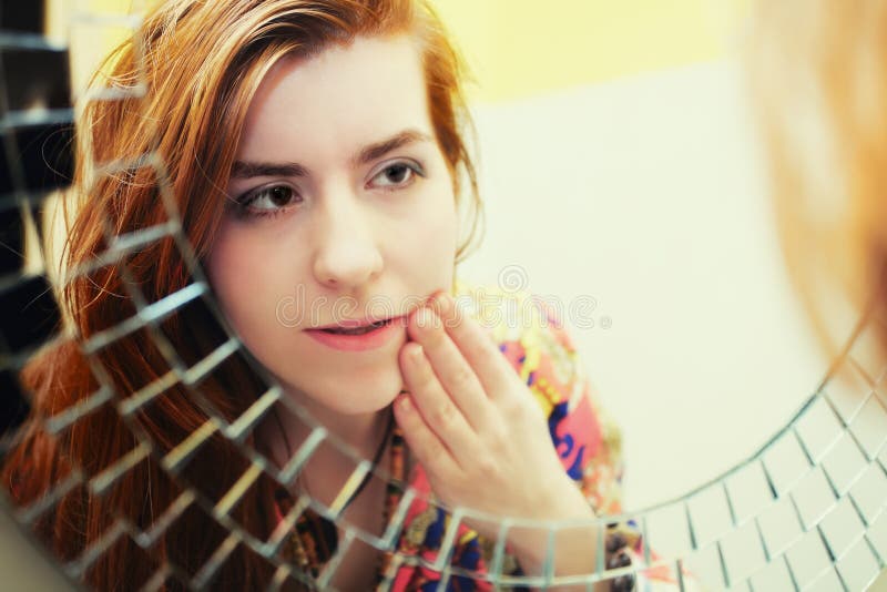 Red-haired girl doing morning makeup