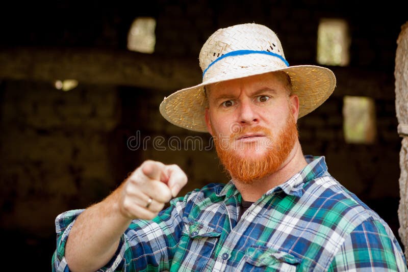 Red haired man with a straw hat