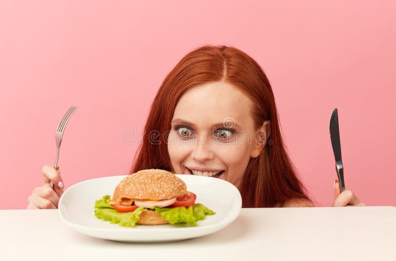 Red Haired Skinny Woman With Greedy Eyes Being Ready To Eat Burger