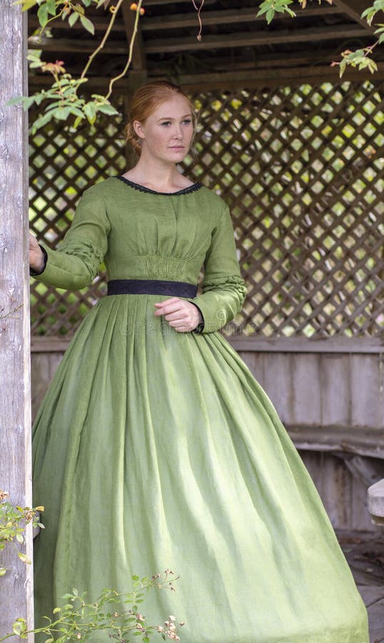 Victorian Woman in Green Dress Walking in Garden Stock Image - Image of ...