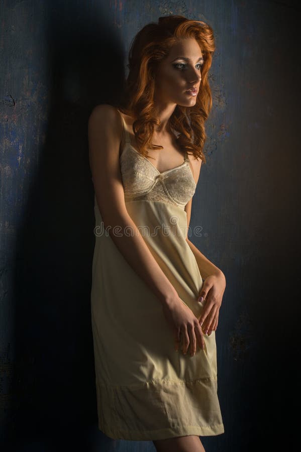 Red haired woman in white dress