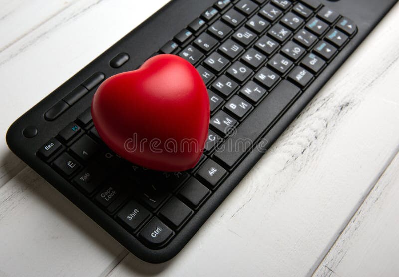Red Heart on Black Pc Keyboard of Notebook site Stock Photo Image