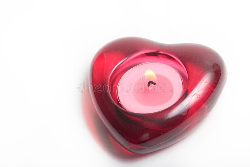 Red heart candle with flame