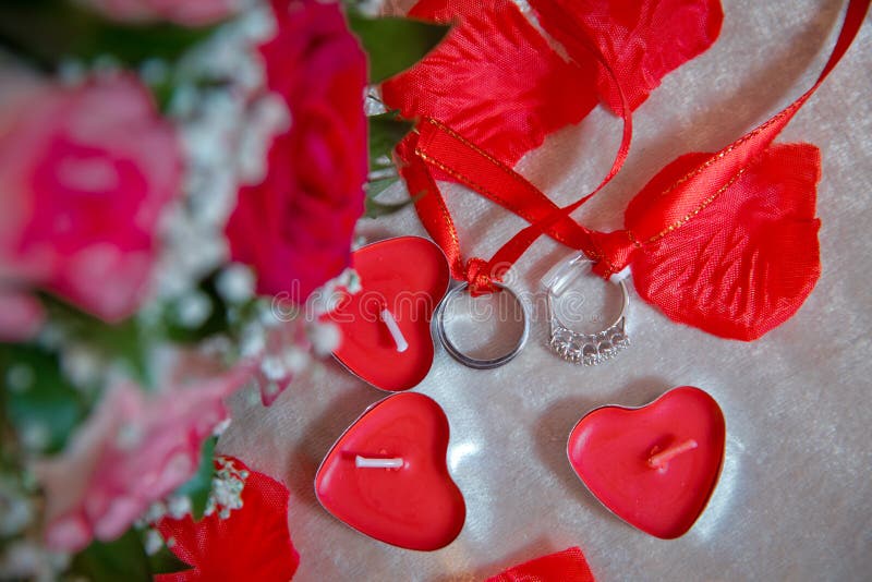 Red Heart Candles . Red Rose Petals . Gold Wedding Rings Stock Image ...