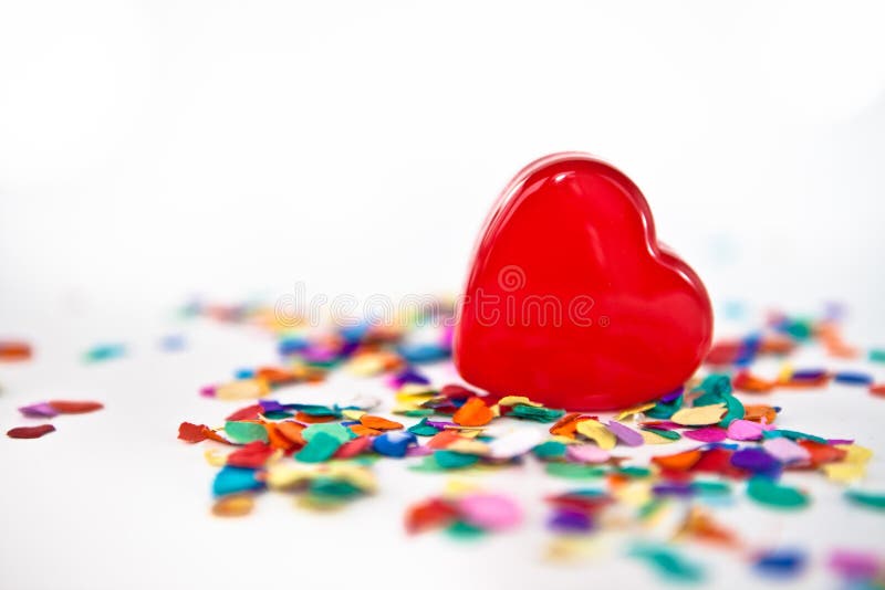 Red heart with confetti royalty free stock photo Red heart with confetti royalty free stock photo