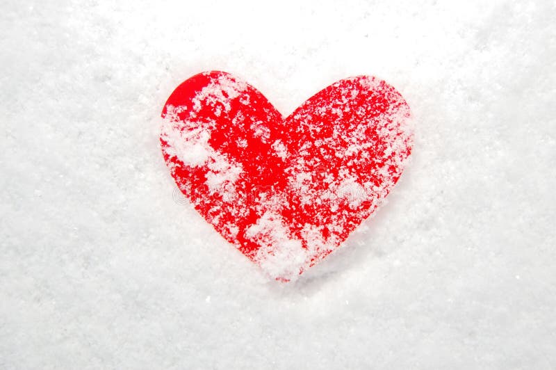 Red heart covered in snow stock image. Image of devotion 36099637
