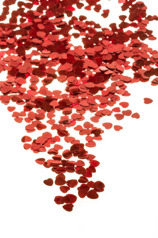 Red Hearts Confetti and Fabric Heart on White Background Stock Photo