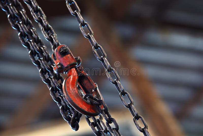 Red hoist and chain on background