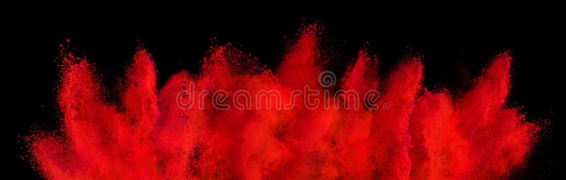 Red holi paint color powder explosion isolated dark black background. industry beautiful party festival concept