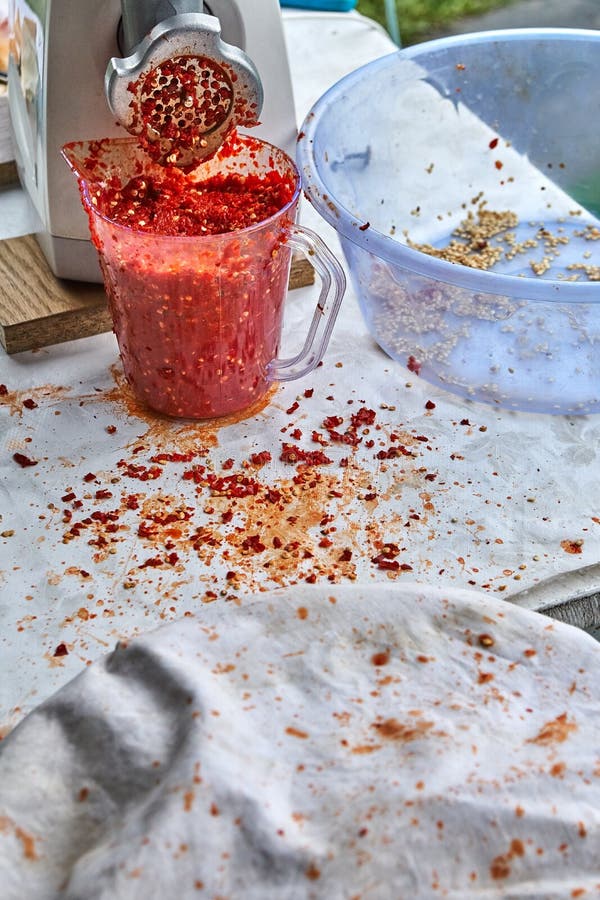 Red Hot Chili Pepper. Making Red Hot Chili Pepper Mash in a Grinder