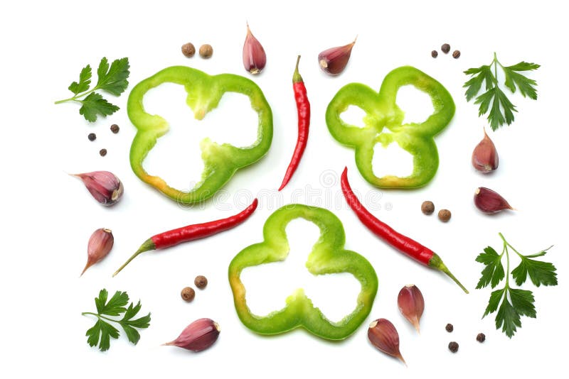 Red hot chili peppers with parsley, garlic and cut slices of green sweet bell pepper isolated on white background top view