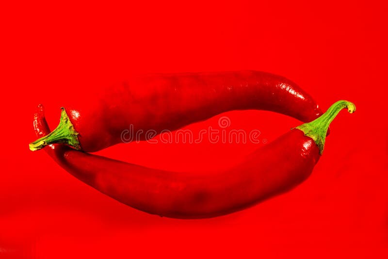 Red hot pepper on a red background