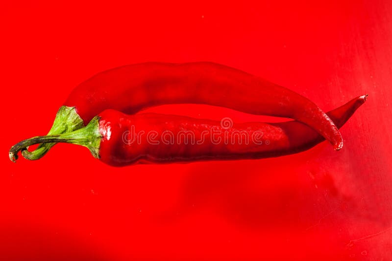 Red hot pepper on a red background