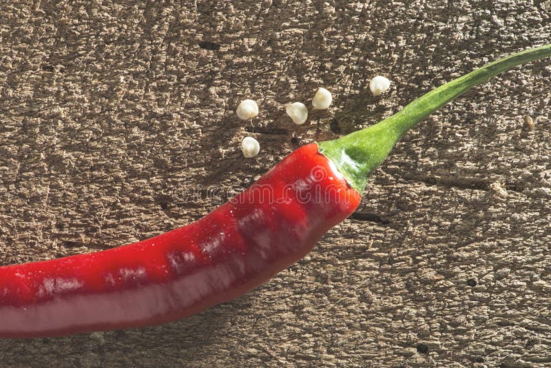Red hot peppers on wooden cutting board stock photography