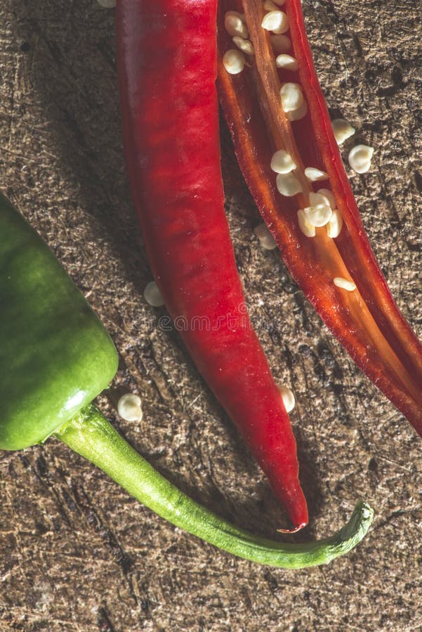 Red hot peppers on wooden cutting board stock photography
