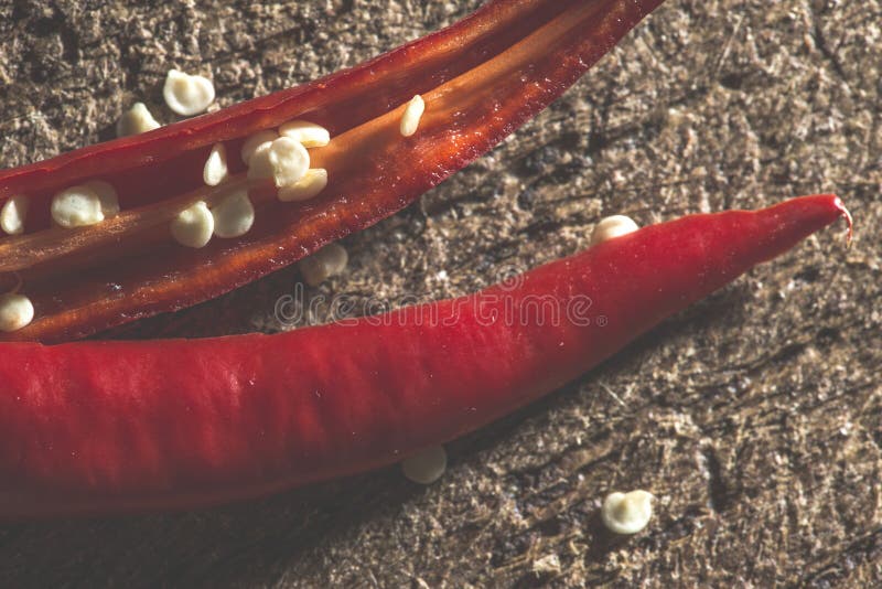 Red hot peppers on wooden cutting board stock image
