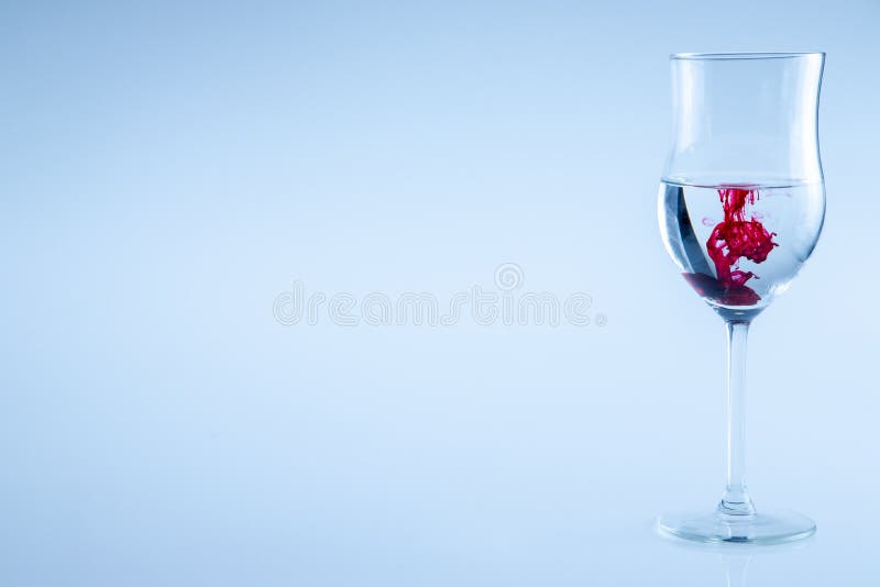 Red Ink Drop, Wine Glass with Water. Half Full Glass Wine Isolated