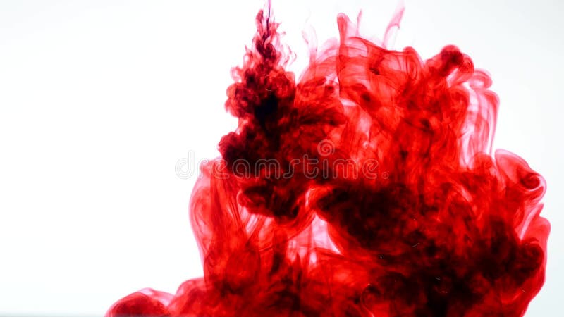 Red ink in water. Abstract