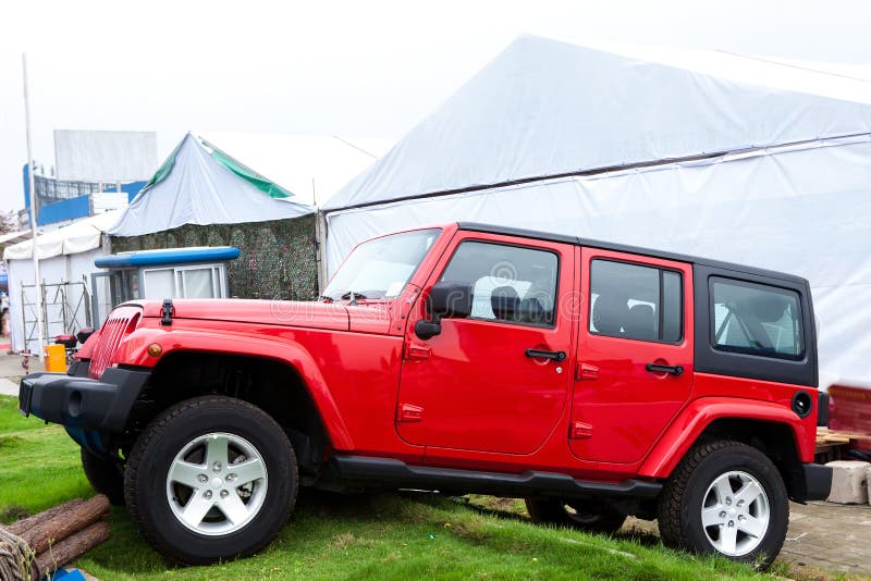 Red jeep on grass