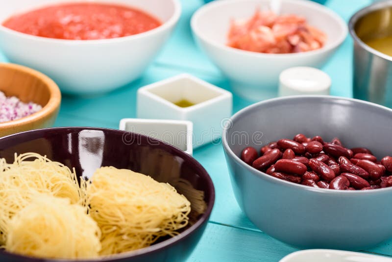 Red Kidney Beans and Food Ingredients on Kitchen Table Stock Image