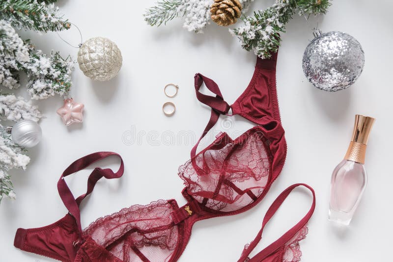 The Concept Of Collecting New Year, Christmas Gifts. Delicate Lace Bra And  Panties, Fir Branches, A Gift Box Lie On A Blue Background. Flat Lay,  Horizontal Orientation. Stock Photo, Picture and Royalty